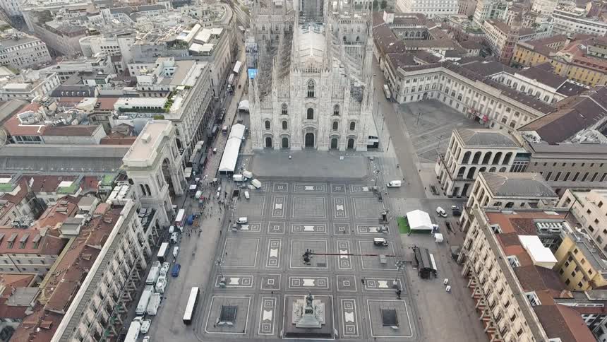 A cathedral sits in the middle of a city