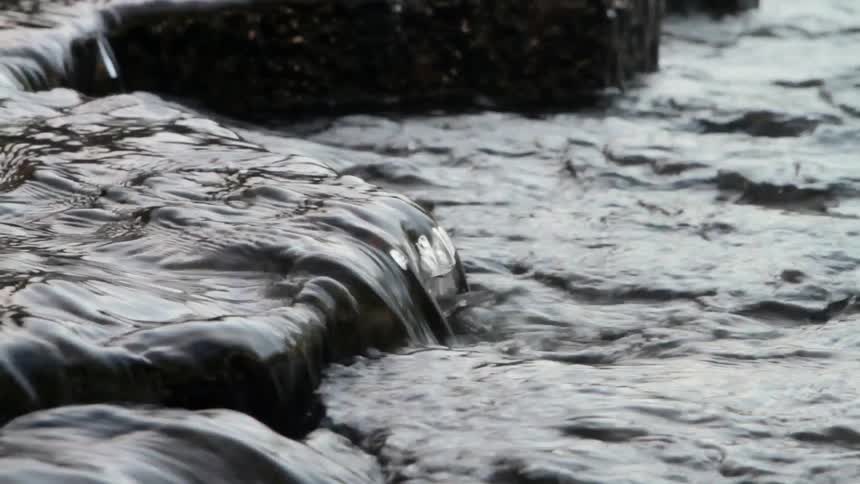 Water Flows Over Rock In Stream