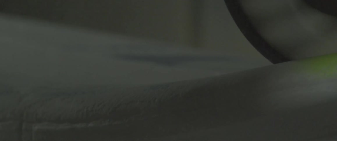 A circular blade cuts through a surface