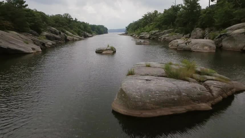 The long stream leads to the cloudy sky ahead