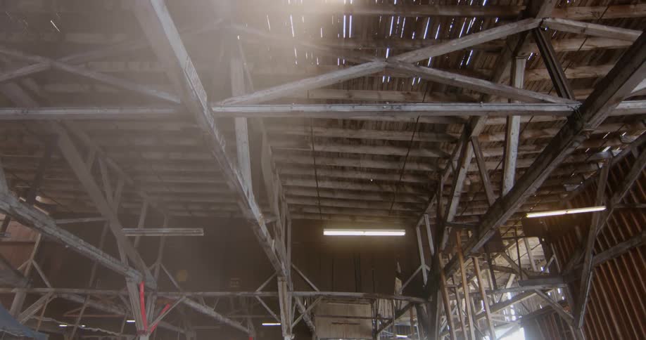 A hangar building is strewn with debris