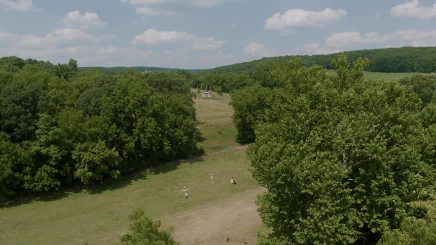 People ride a zip line at high speed