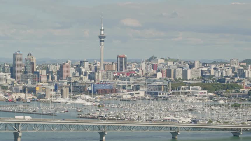 A large city with a busy bridge in the foreground
