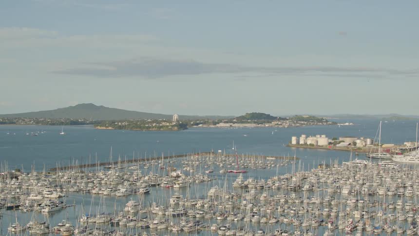 The docks are full of boats with their sails down