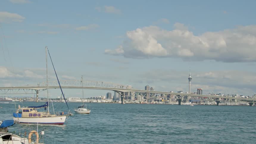 Ships float near city buildings