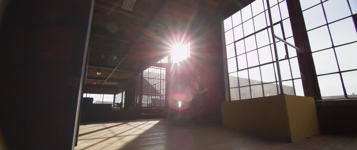 A person doing parkour in a building