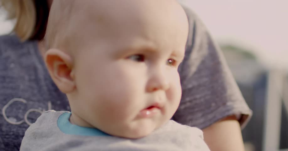 A woman holds a baby