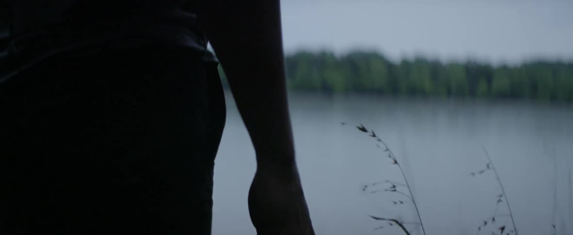 Person walks near a lake