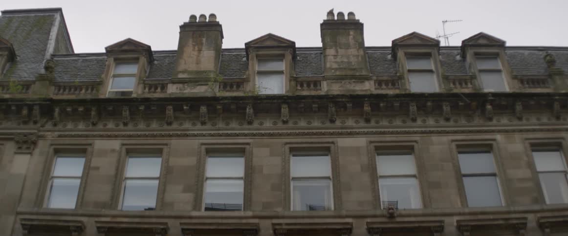 The building is made of stone and has many windows