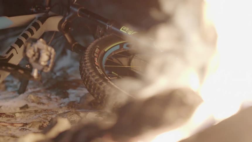 A bike is laying next to a fire