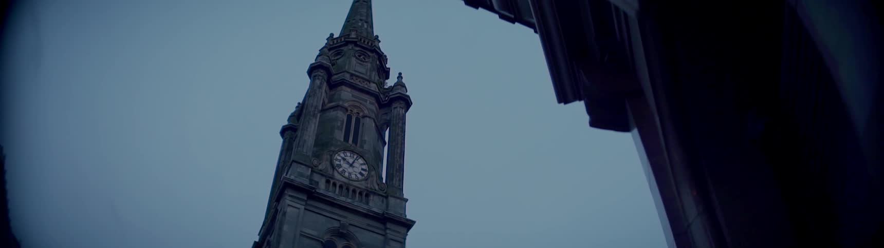 A clock tower stands tall in the sky