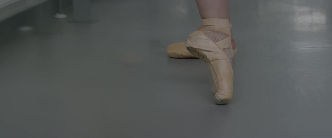 A ballet dancer practices in a dance studio