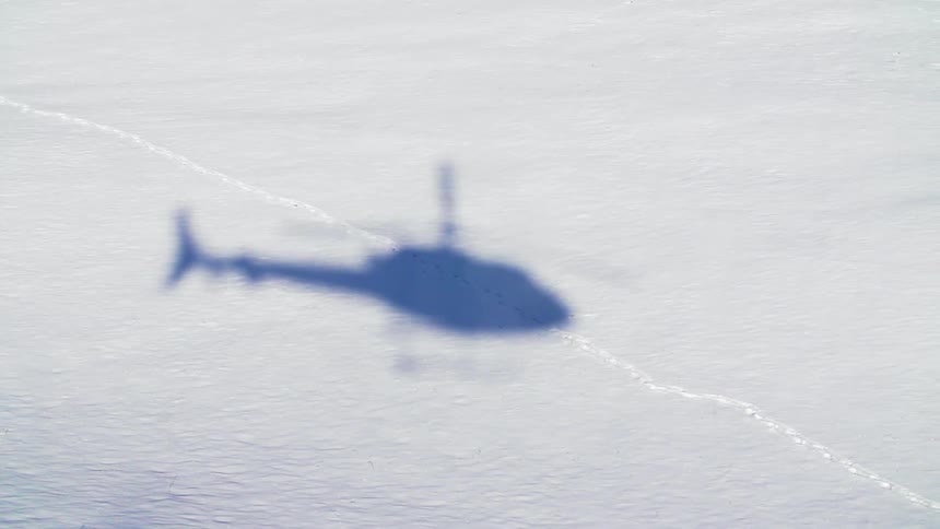 A helicopter flies in the sky