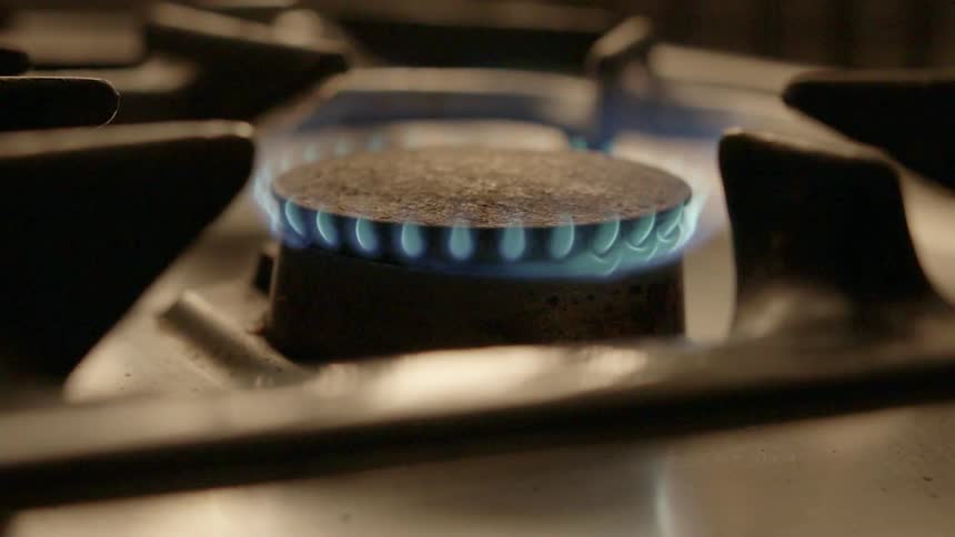 A stove burner is ignited