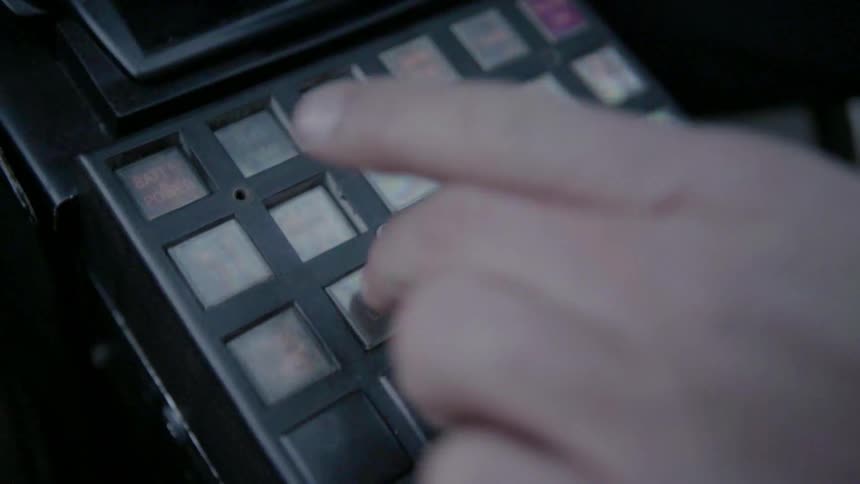 A person pushes buttons on a control pad