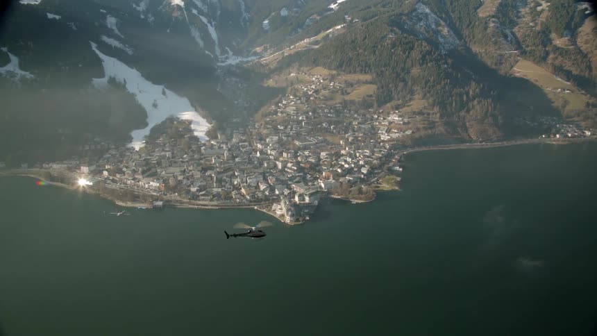 A helicopter flying over water