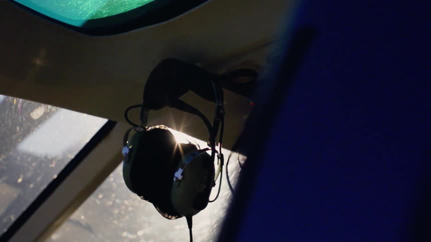 Sunlight shines into a helicopter cockpit