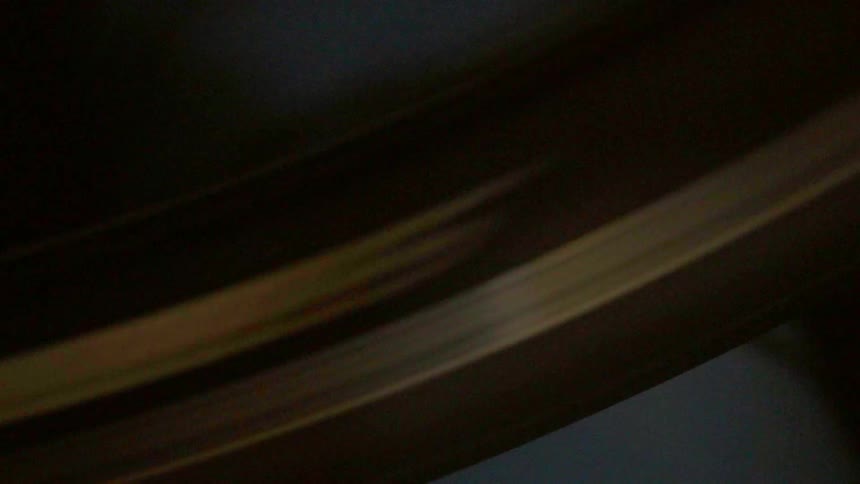 A bike tire is spinning really fast close up