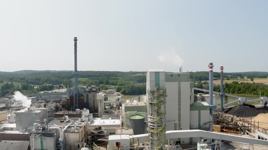 A factory is working in the middle of the day