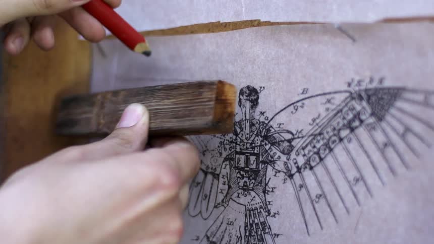 A person traces a line with a pencil