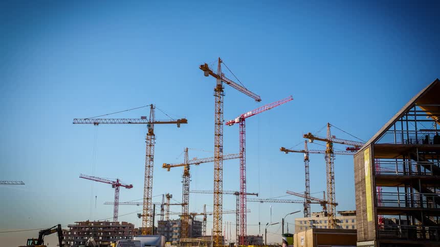 Cranes help build large buildings