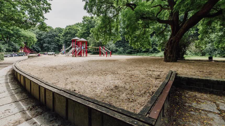 Children climb and play on the playground equipment