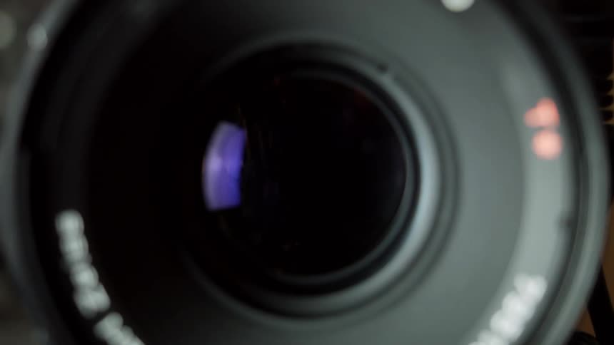 A cameras lens shuts and opens rapidly