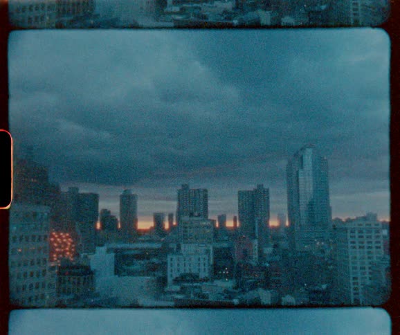 Clouds hang above the city skyline