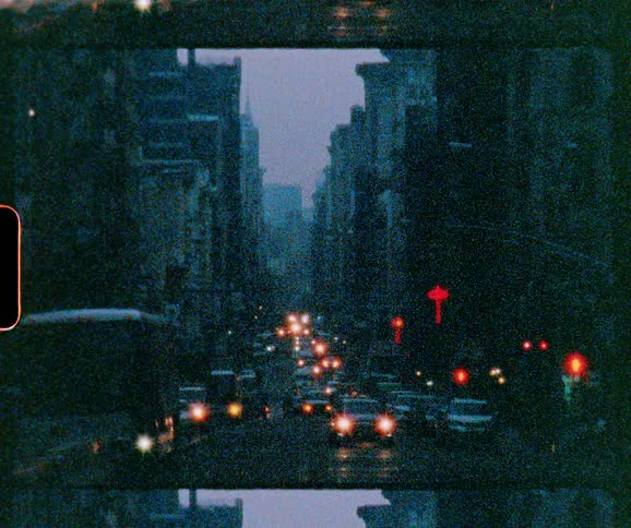 Vehicles travel on a busy city street