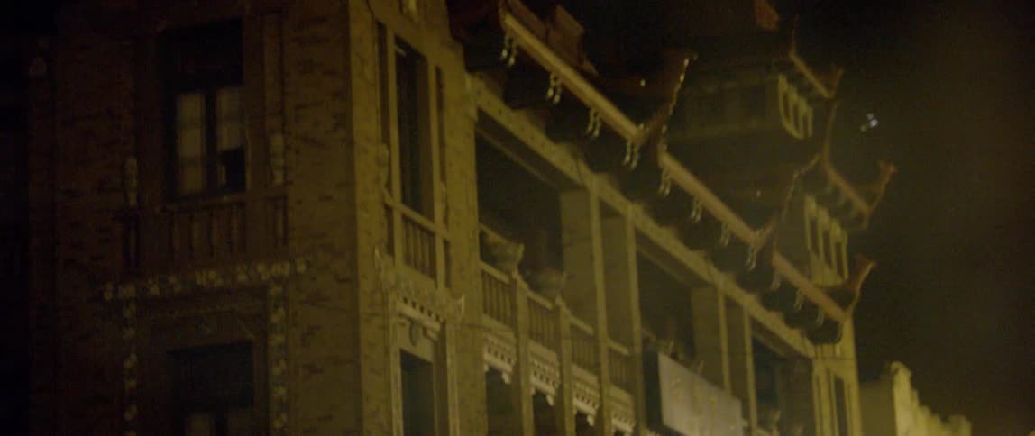 Old buildings in the downtown of a city at night
