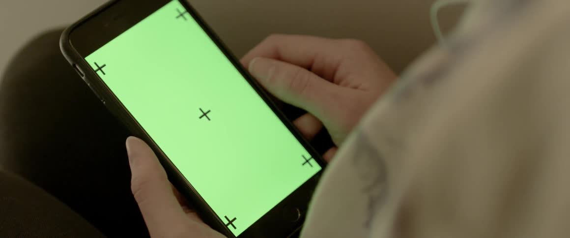 A person looks at a blank screen on their phone