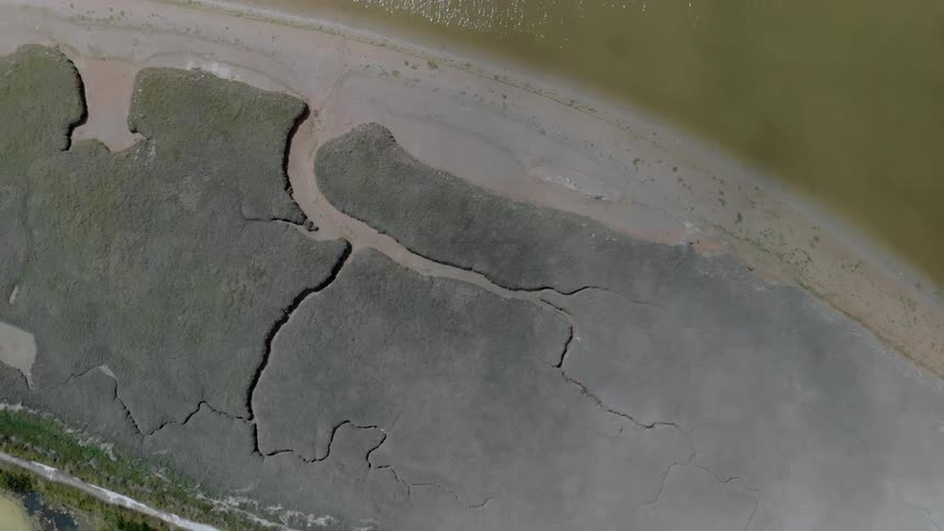 Cracks in the ground near a beach