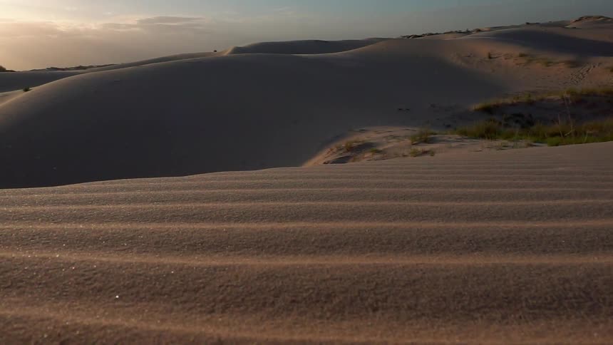 The desert is barren and empty at dawn