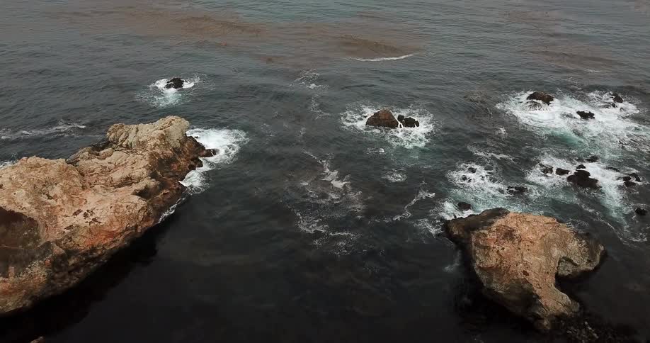 Waves flow onto the rocky shore