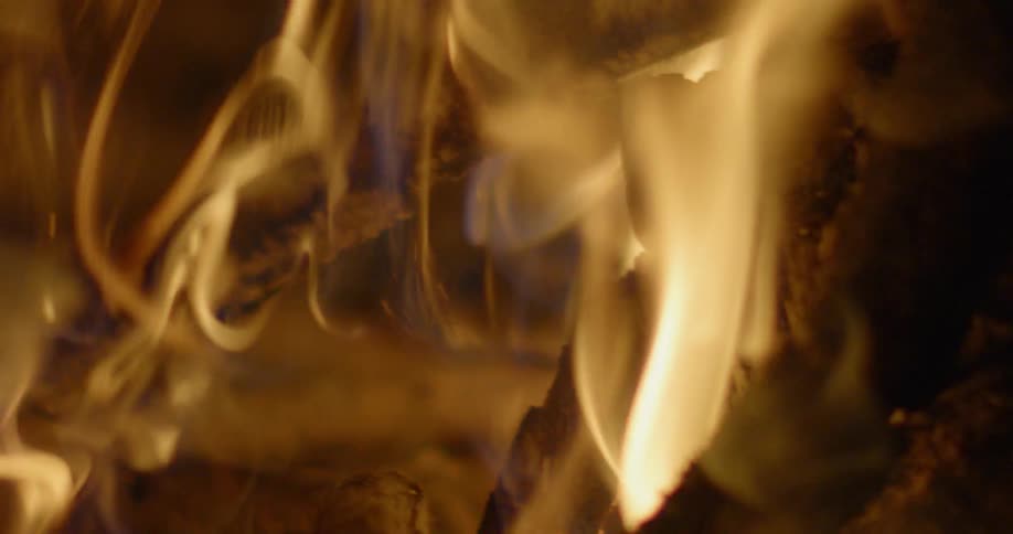 A fire is burning logs