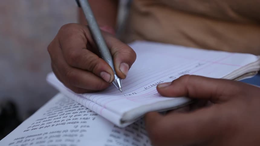 Hand writing in a notebook