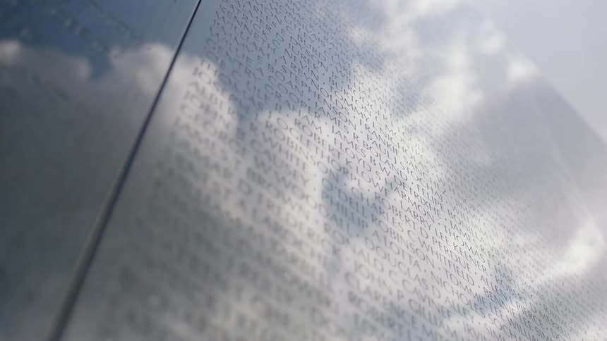 Clouds are reflected on a military monument