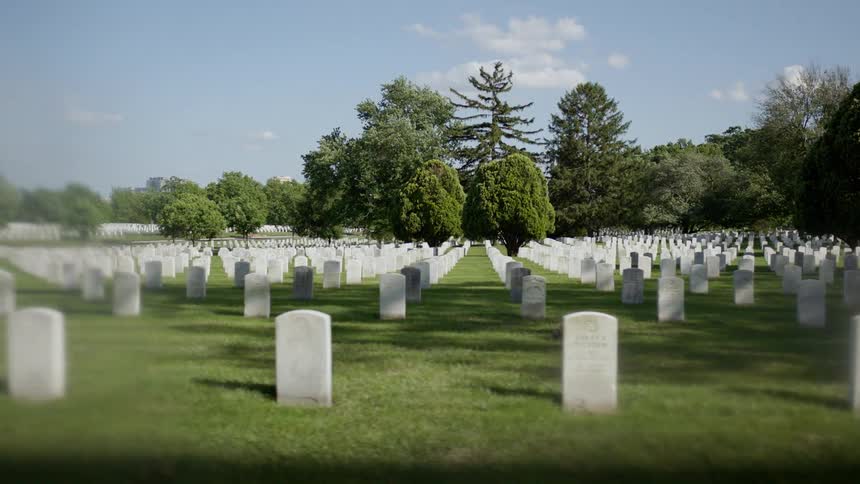 Many rows of headstones in a cemetery