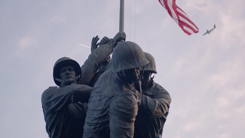 A war memorial statue is displayed outside