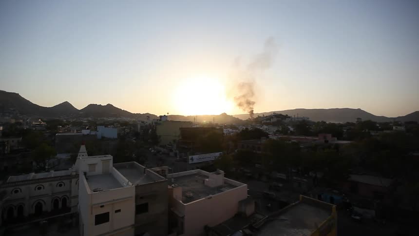 A overhead view of smoking rising in the distance