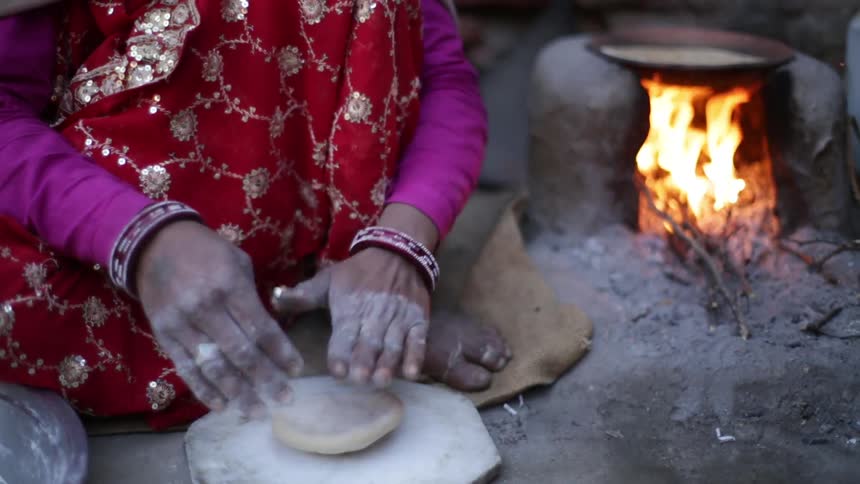 A person shaping dough