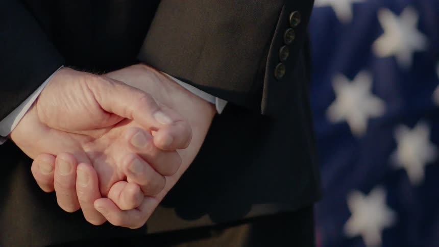 A man grieves at a funeral