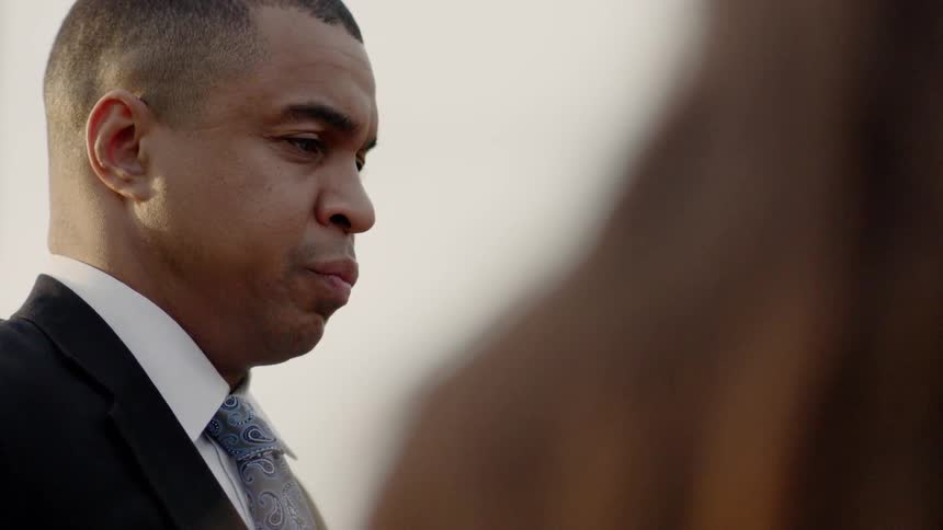 A man in a suit is looking sad