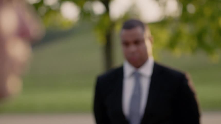 Two men are standing around looking sad