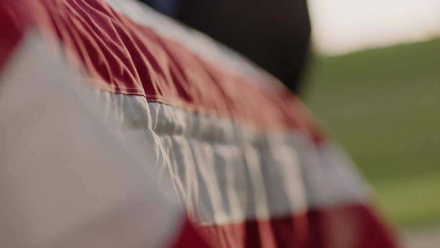 Close up of a flag covered coffin
