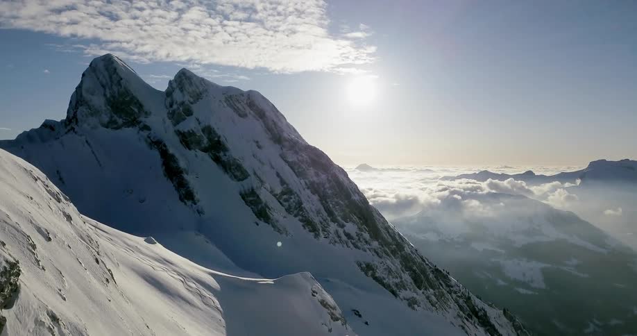 Snow covers the tall mountains