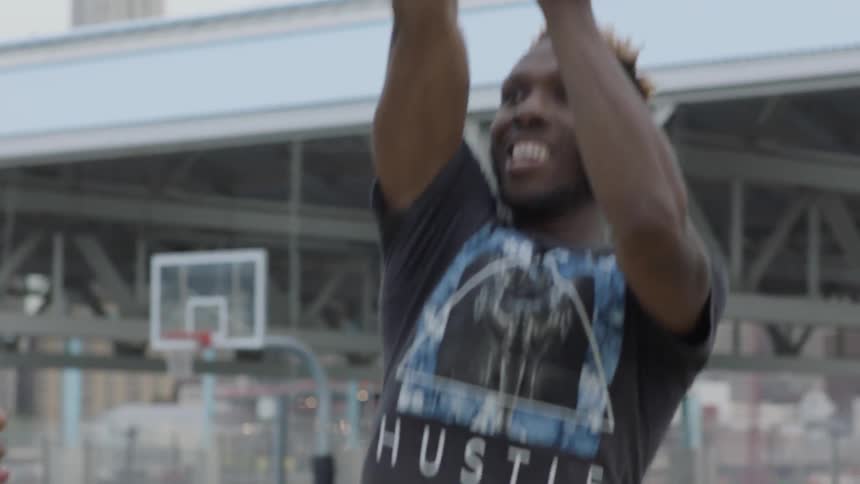 A group of people are playing basketball
