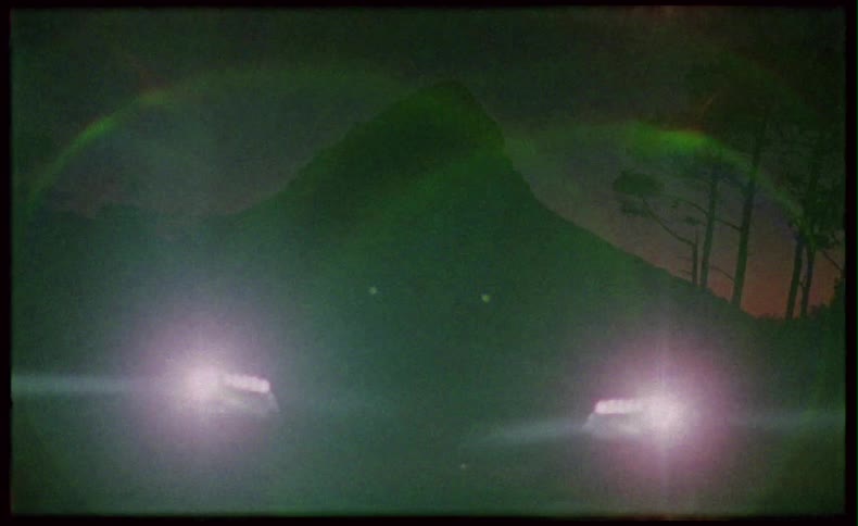Car lights shining at night