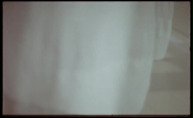 Curtains in a room blowing in the wind