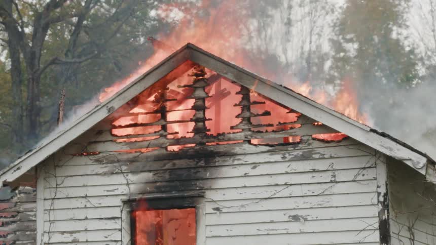 A house fire rages outdoors